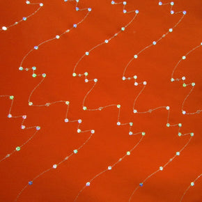 Silver/Orange Sequin On Crepe Fabric